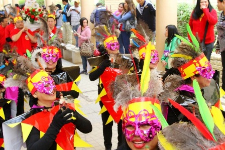 Colorful costumes and painted faces add joy to the occasion.