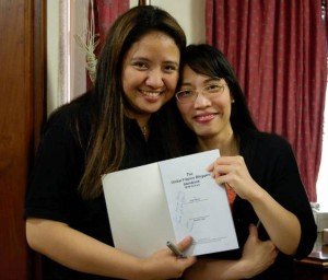 Vice Consul Shiena Tesorero shows her book copy with autograph.